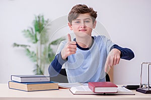 Schoolboy studying physics at home