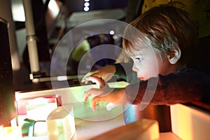 Boy studying the refraction of light