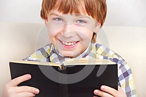 Boy studying the scriptures.