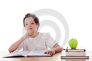 Boy studying and thinking, along with one on apple