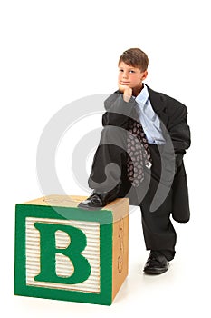 Boy in Suit with Alphabet Block