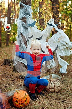 boy in a suit of Spiderman for Halloween