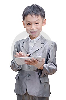 Boy in suit using tablet computer