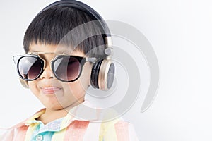 Boy with Sunglasses is listen to music headphone isolated