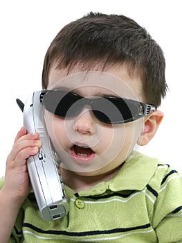 Boy In Sunglasses Speaking On The Phone Over White