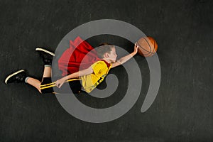 Boy superhero basketball player