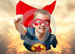 Boy in superhero costume guard the planet and show super abilities.