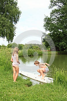 Boy on a surf watched by a girl