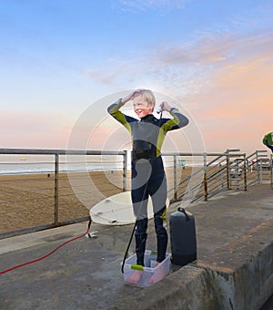 Boy Surfer Showering At Beach photo