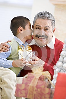 Boy Surprising Father With Christmas Present