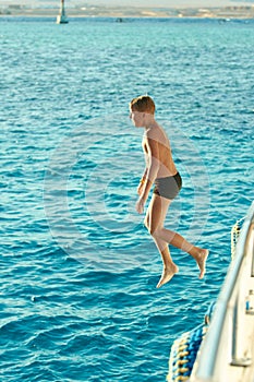 Boy swiming at red sea