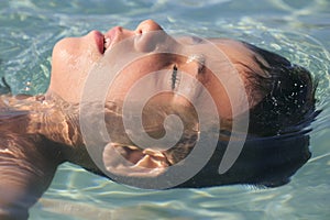 Boy swimming on the beach