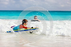 Boy swimming on boogie board