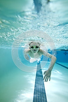 Boy swimming laps photo