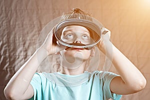 Boy in a swimming mask looking up