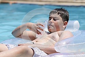 Boy in swimming in the pool