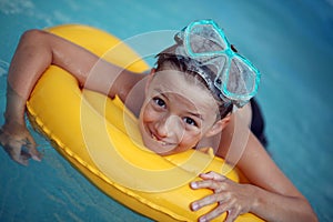 Boy in swimming pool