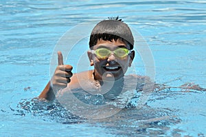 Boy in swimming in the pool