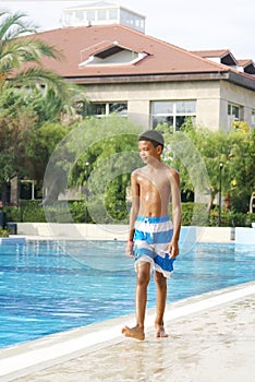 Boy at swimming pool.