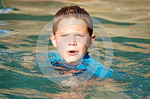 Boy swimming in the pool