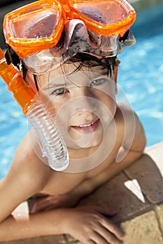 Boy In A Swimming Pool with Goggles and Snorkel