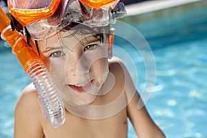 Boy In A Swimming Pool with Goggles and Snorkel