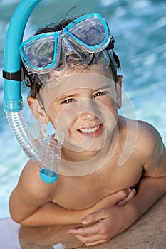 Boy In A Swimming Pool with Goggles and Snorkel