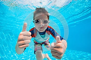 Boy swimming underwater