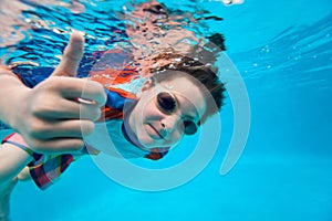 Boy swimming underwater