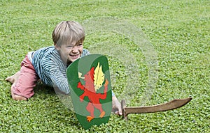Boy sword shield grass