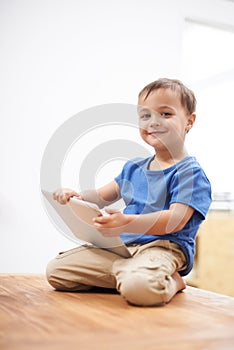 Boy, tablet and portrait with games, kid and internet with network, connection and home. Child development, apartment