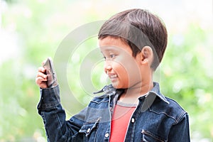 boy takes selfie with mobile phone