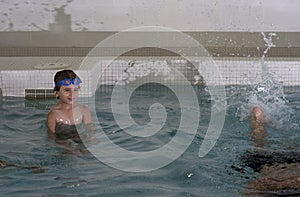 Boy taking a swim lesson