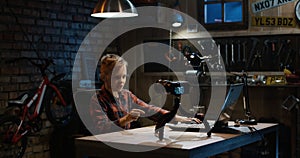 Boy talking on camera in a garage