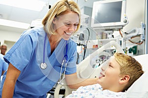 Boy Talking To Female Nurse In Emergency Room