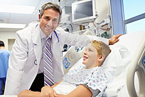 Boy Talking To Male Doctor In Emergency Room