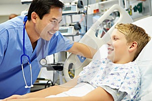 Boy Talking To Male Nurse In Emergency Room