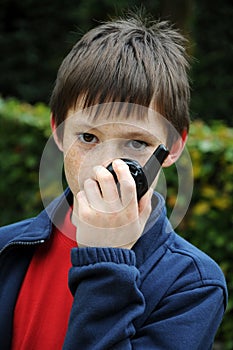 Boy talks on  walkie talkie