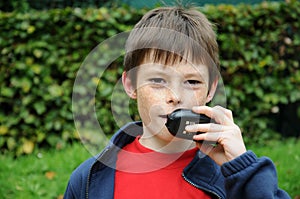 Boy talks on  walkie talkie
