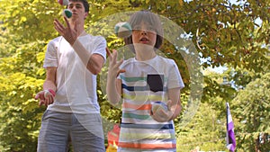 Boy and teacher with balls. Learning to juggle impact growth neural connections