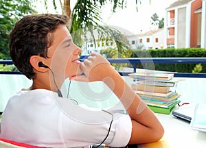 Boy teenager relaxed outdoor earphones