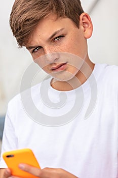 Boy teenager teen male child using mobile cell phone for social media