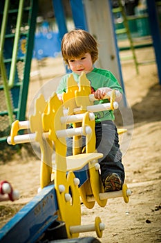 Boy on teeterboard