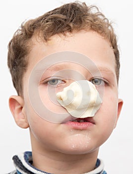 Boy with a test on the nose