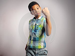 A boy threatening with his fist.