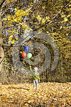 boy with three balloons