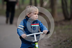boy three years riding on balance bike, run bike