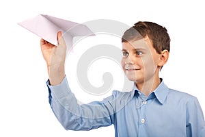 Boy throwing a paper plane