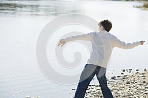 Boy Throwing Stones