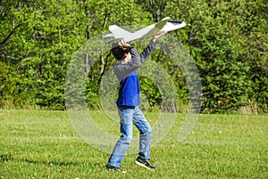 Boy Throwing Toy Plane